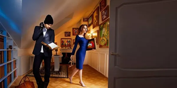 A couple sneaks through a luxurious villa